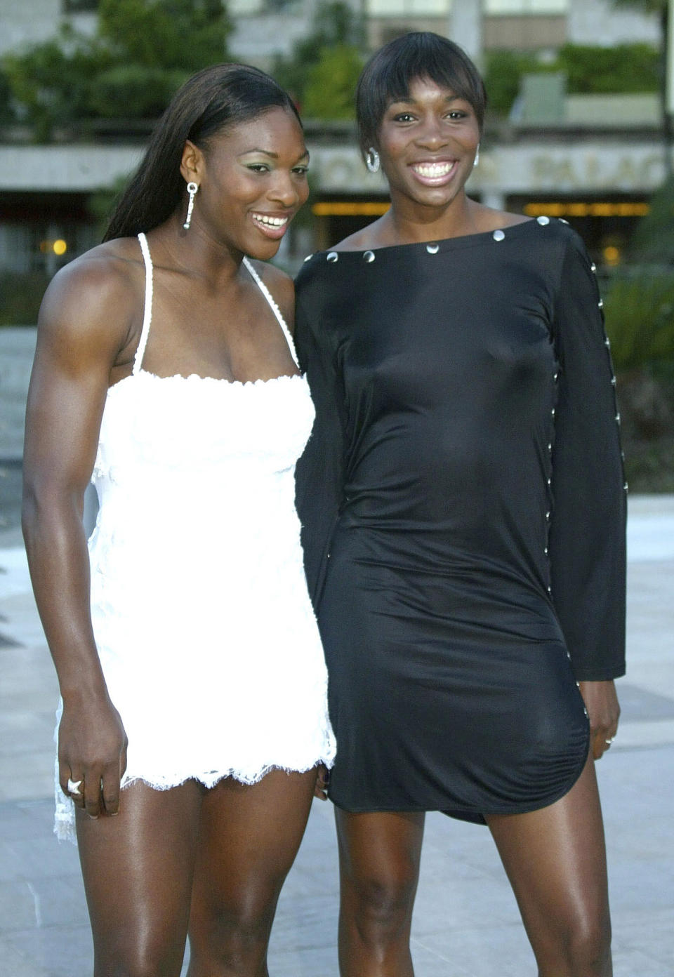 FILE - United States tennis players Serena Williams, left, and her sister, Venus, pose at the 4th Laureus Sports Awards ceremony, Tuesday, May 20, 2003, in Monaco. Saying “the countdown has begun,” 23-time Grand Slam champion Serena Williams announced Tuesday, Aug. 9, 2022, she is ready to step away from tennis so she can turn her focus to having another child and her business interests, presaging the end of a career that transcended sports. (AP Photo/Lionel Cironneau, File)