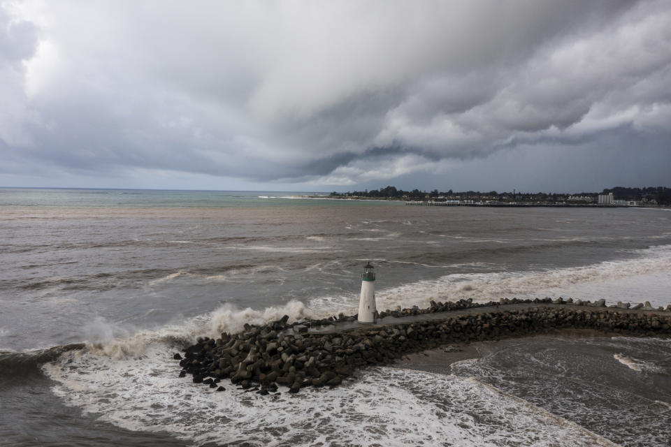 Storm clouds hang over Walton Lighthouse, Thursday, Feb. 1, 2024, in Santa Cruz, Calif. The first of two back-to-back atmospheric rivers drenched California on Thursday, flooding roads and toppling trees while triggering statewide storm preparations and calls for people to get ready for powerful downpours, heavy snow and damaging winds. (AP Photo/Nic Coury)