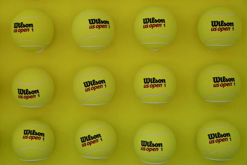 Large tennis balls are displayed on the grounds of the U.S. Open tennis tournament in New York, Thursday, Aug. 25, 2022. The U.S. Open, the year’s last Grand Slam tennis tournament, starts Monday. (AP Photo/Seth Wenig)