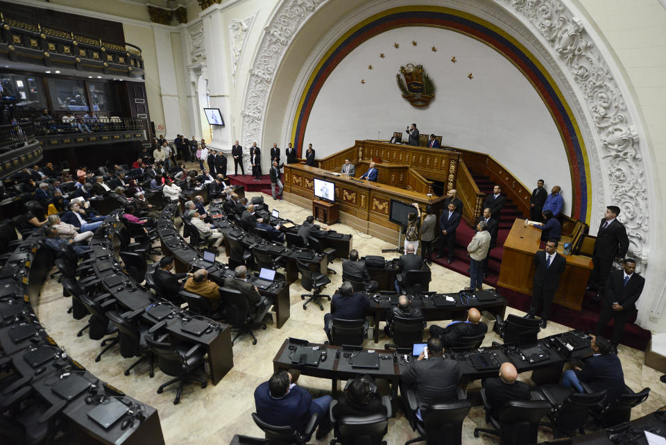 Lawmaker Luis Parra, who broke with opposition leader Juan Guaido and claims the presidency of the National Assembly, leads a session at the National Assembly in Caracas, Venezuela, Tuesday, Jan. 21, 2020. (AP Photo/Matias Delacroix)