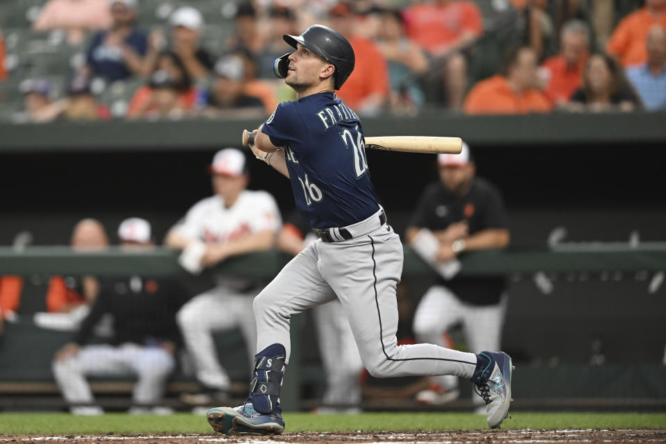 Seattle Mariners' Adam Frazier follows through on a single against the Baltimore Orioles in the third inning of a baseball game Tuesday, May 31, 2022, in Baltimore. (AP Photo/Gail Burton)