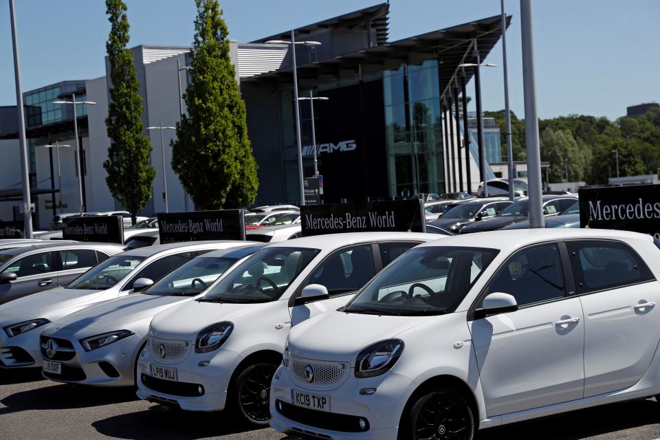 New and used cars are on show at a Mercedes-Benz Brooklands and Mercedes-Benz World car dealership near Woking, southwest England on May 29, 2020. - The motor trade is calling for the UK to introduce a car scrappage scheme to help jump-start the economy and replace older, more polluting models. (Photo by ADRIAN DENNIS / AFP) (Photo by ADRIAN DENNIS/AFP via Getty Images)