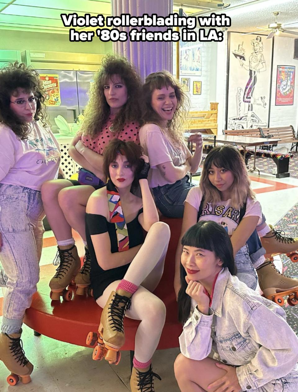 Six women posing in roller skates in a retro-themed setting. They have different poses and expressions, each showcasing unique fashion styles