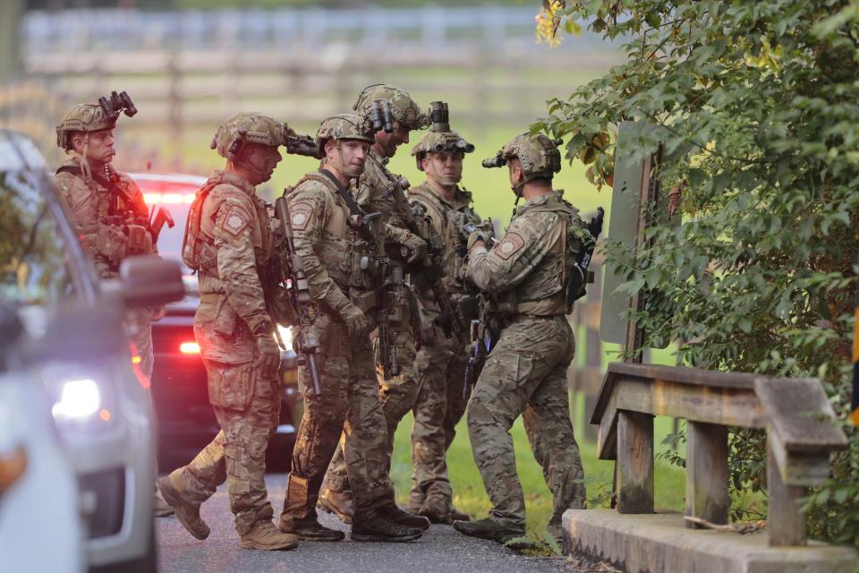 Pennsylvania State police search the woods and a creek in Pennsbury Township on Sept. 5, 2023..