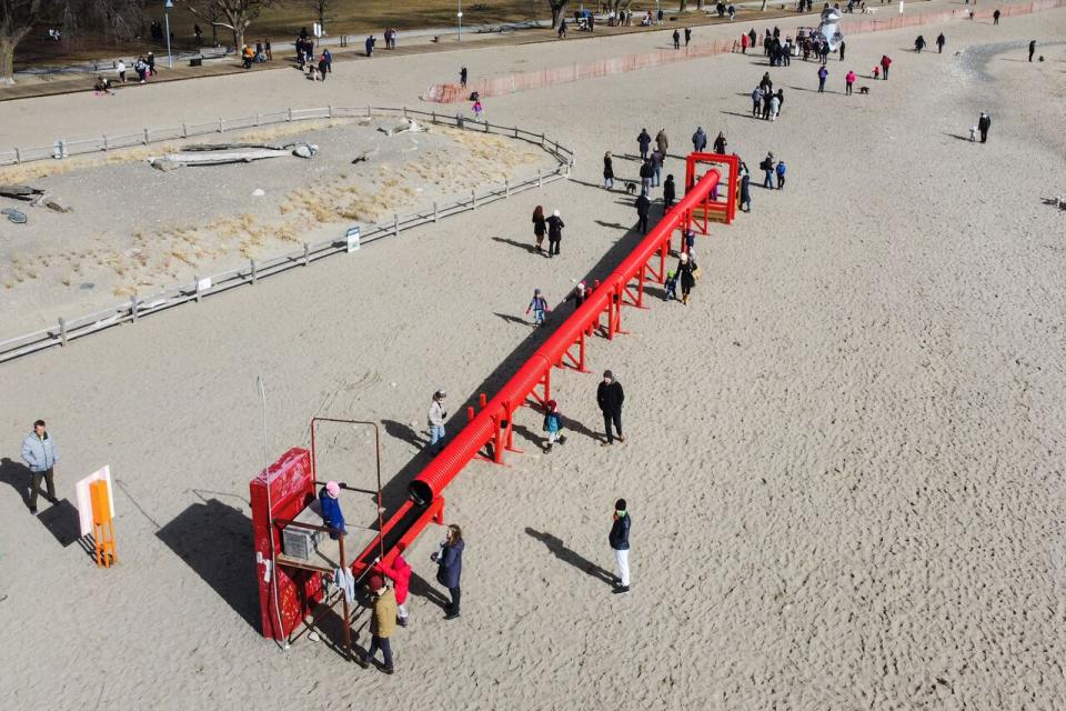 Life Line, one of the art exhibits shown at Winter Stations' 2023 event at Woodbine Beach. There are no mobility mats between each station allowing people with mobility limitations or disabilities to travel between exhibits, meaning some viewers are stuck on the beach's boardwalk.