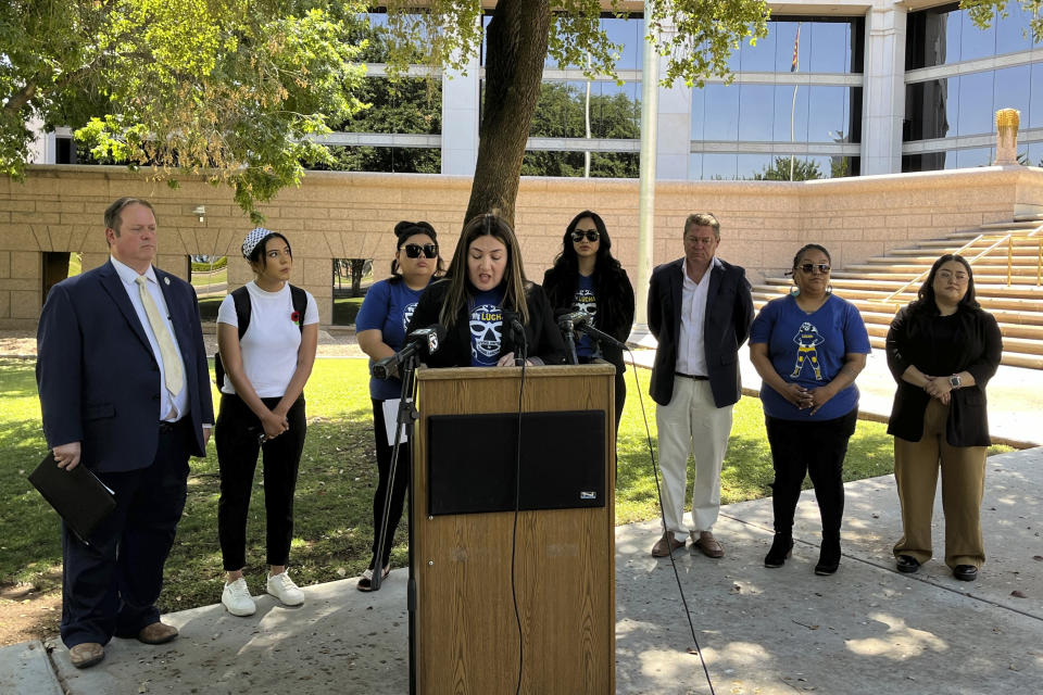 Jacques Alejandra Gomez, executive director of Latino advocacy group Living United for Change in Arizona, speaks at a news conference outside the Arizona Supreme Court, Wednesday, June 5, 2024, in Phoenix. The news conference was focused on the group's lawsuit that asks a court to prevent a border proposal from appearing on Arizona's ballot in November because it contains an alleged constitutional defect. (AP Photo/Jacques Billeaud)