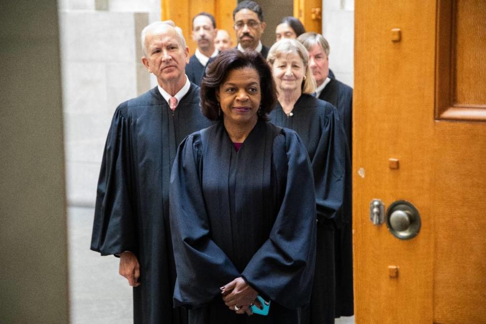 Chief Justice Cheri Beasley leads the Supreme Court of North Carolina into the State Capitol Building’s historic Senate Chamber to hear oral arguments Wednesday, May 29, 2019.