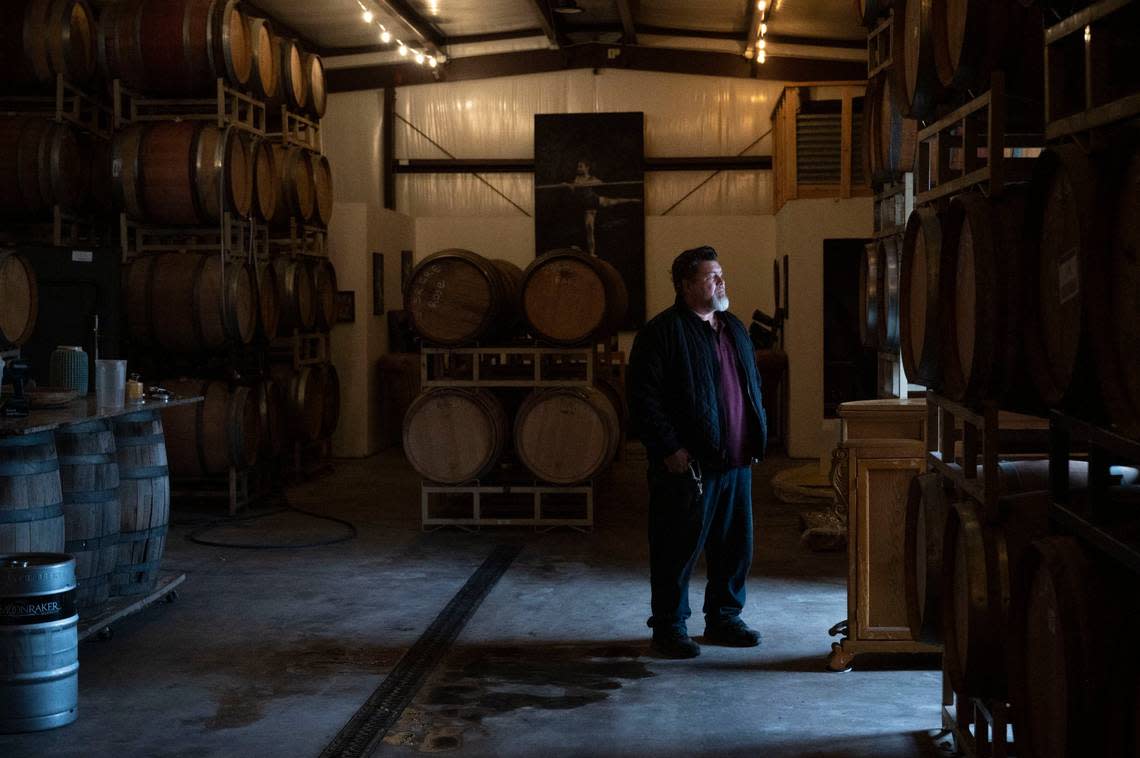 Eric Hays, owner of Chateau Davell, stands inside his wine making warehouse at his modest winery in Camino last month. The cost of property insurance for his small business recently doubled to about $16,000 a year. Lezlie Sterling/lsterling@sacbee.com