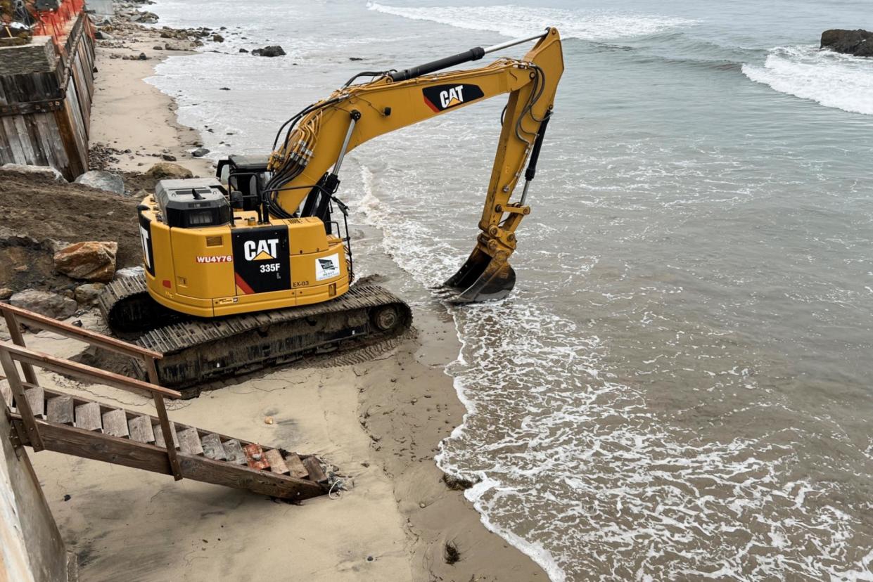 <span>The lawsuit included a photo of an excavator gathering sand in Broad Beach, California.</span><span>Photograph: Obtained by The Guardian</span>