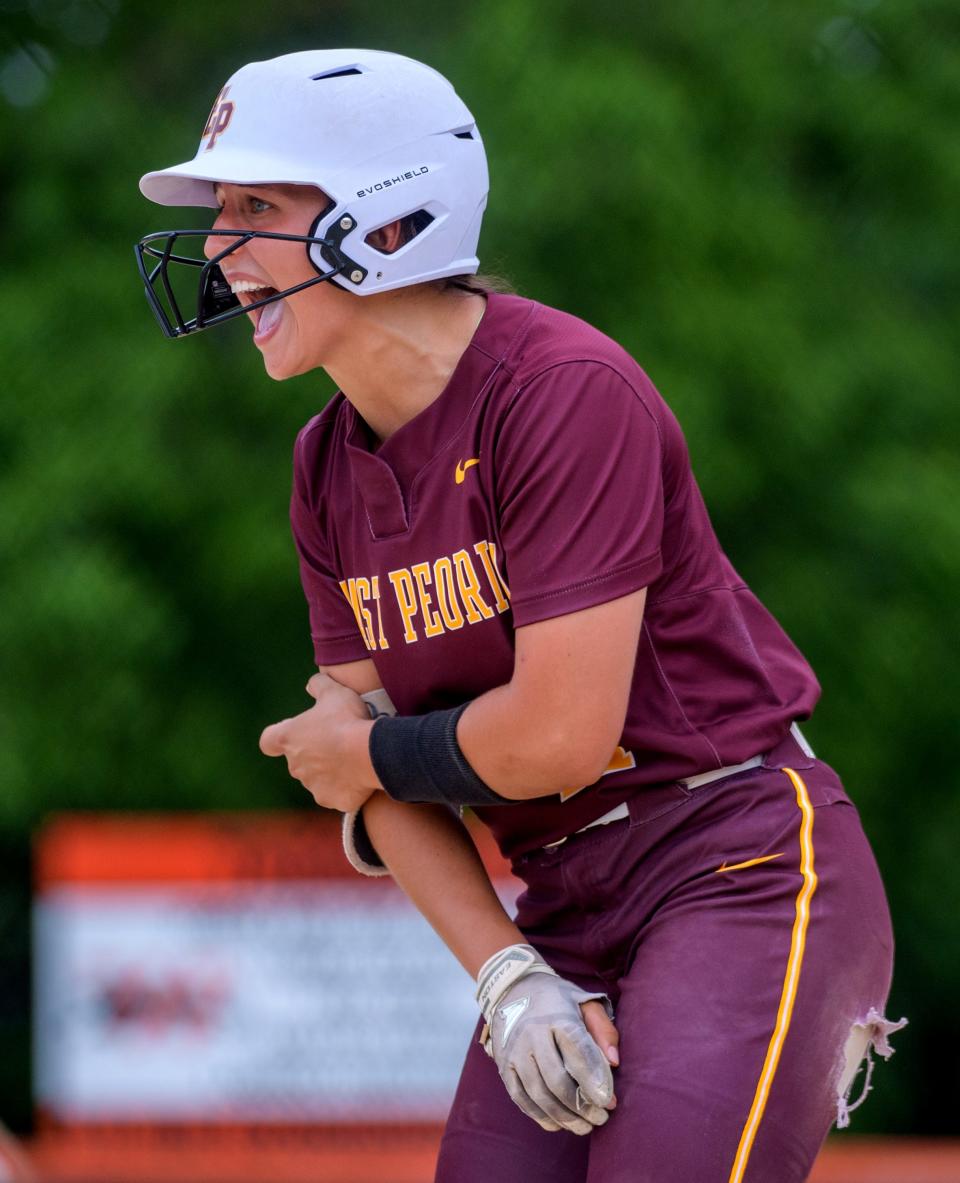 East Peoria's Bri Despines is pumped up as she gets on base in the first inning against the Rock Island Rocks during their Class 3A softball sectional semifinal Tuesday, May 31, 2022 at Jan Smith Field in Washington. The Raiders held on to win 12-11 to advance to the title game against Metamora on Friday in Washington.