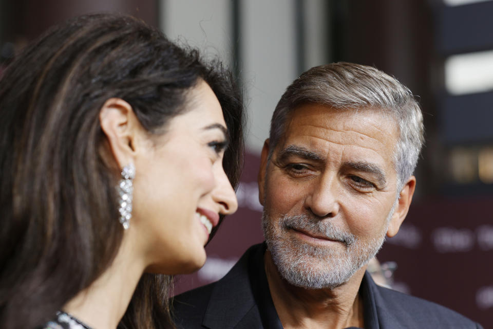 Amal Clooney and George Clooney are pictured at the "Tender Bar" premiere on October 03, 2021