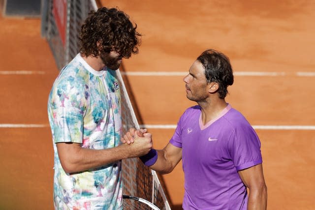 Rafael Nadal (right) defeated seven-foot-tall Reilly Opelka