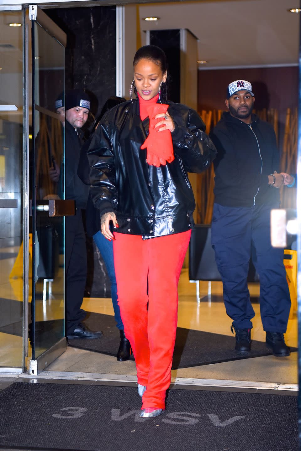 <p>In a red Vetements x Juicy Couture tracksuit, Vetements metallic boots, black leather jacket, red leather gloves and diamond hoop earrings while out in New York.</p>