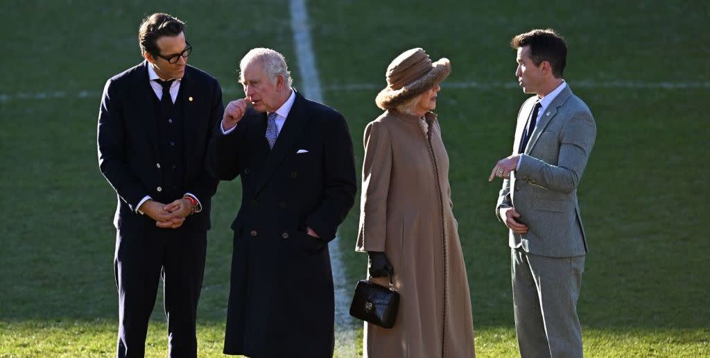 britains king charles iii 2l and britains camilla, queen consort 2r talk with wrexham afc co chairman, us actor ryan reynolds l and us actor rob mcelhenney during their visit to wrexham association football club in north wales on december 9, 2022 photo by oli scarff  afp photo by oli scarffafp via getty images