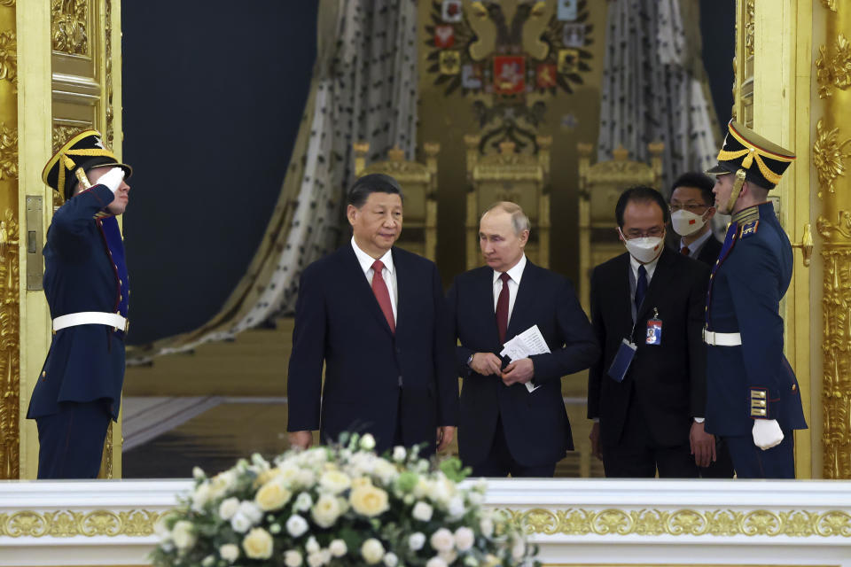 Russian President Vladimir Putin, center right, and Chinese President Xi Jinping enter a hall for their talks at The Grand Kremlin Palace, in Moscow, Russia, Tuesday, March 21, 2023. (Sergei Karpukhin, Sputnik, Kremlin Pool Photo via AP)