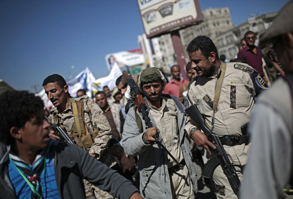 Houthi fighters take part in a protest calling for the reopening of Sanaa airport to receive medical aid, in front of the U.N. offices in Sanaa, Yemen, Monday, Dec. 10, 2018. (AP Photo/Hani Mohammed)