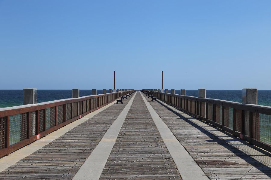 The Casino Beach Fishing Pier reopens to the public Friday, April 26 at noon. Work included replacing pier signage, lighting, water lines, and the entrance gate, and repairs to timber railing and blow-out deck panels. (Photo courtesy of Escambia County)