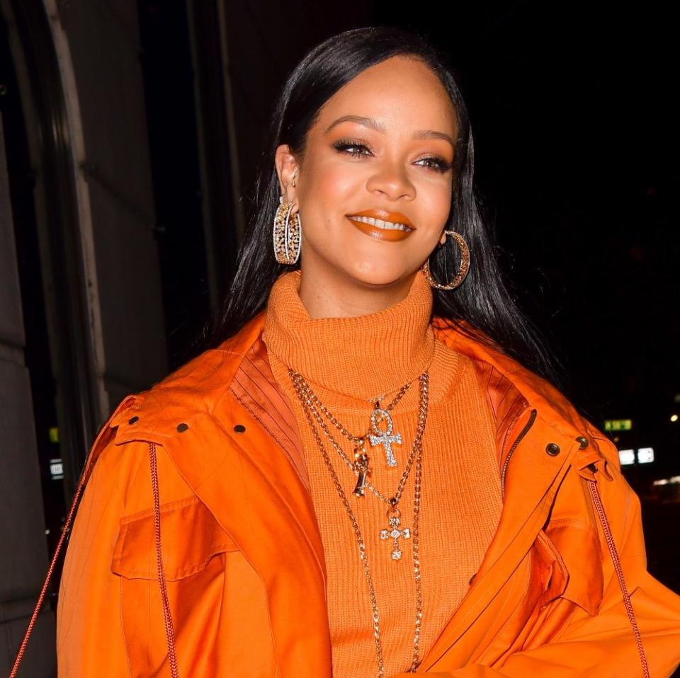 Rihanna with silky orange lip gloss in February 2020