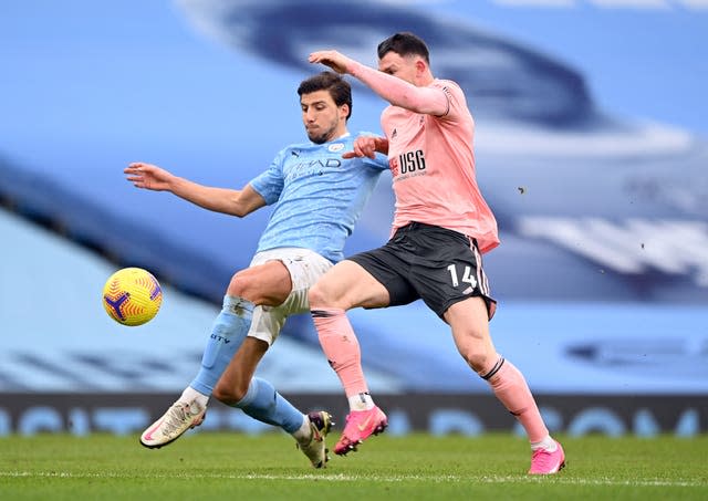 The signing of Ruben Dias (left) has transformed Manchester City's defence