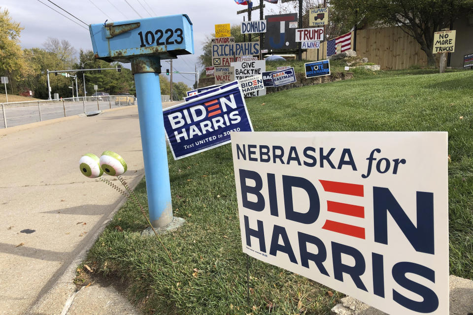 A Joe Biden presidential campaign sign greets passersby in a leafy neighborhood of Omaha, Neb., Monday, Oct. 19, 2020. If the election is close, Nebraska could play a pivotal role in deciding the winner because the state is able to divide its electoral votes, as it did when President Barack Obama won the Omaha-based 2nd Congressional District in 2008. Maine is the only other state that awards Electoral College votes by congressional district, and it could go the opposite way and award a vote to Donald Trump even as the state as a whole likely will go to Biden. (AP Photo/Grant Schulte)