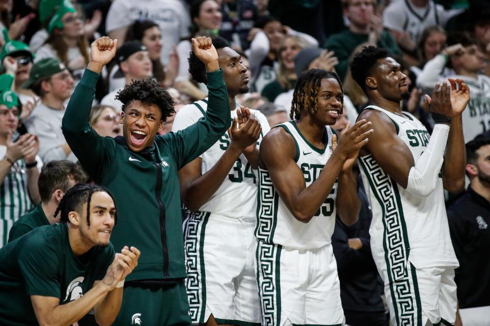 Michigan State bench players celebrate a play against Michigan during the second half at Breslin Center in East Lansing on Tuesday, Jan. 30, 2024.