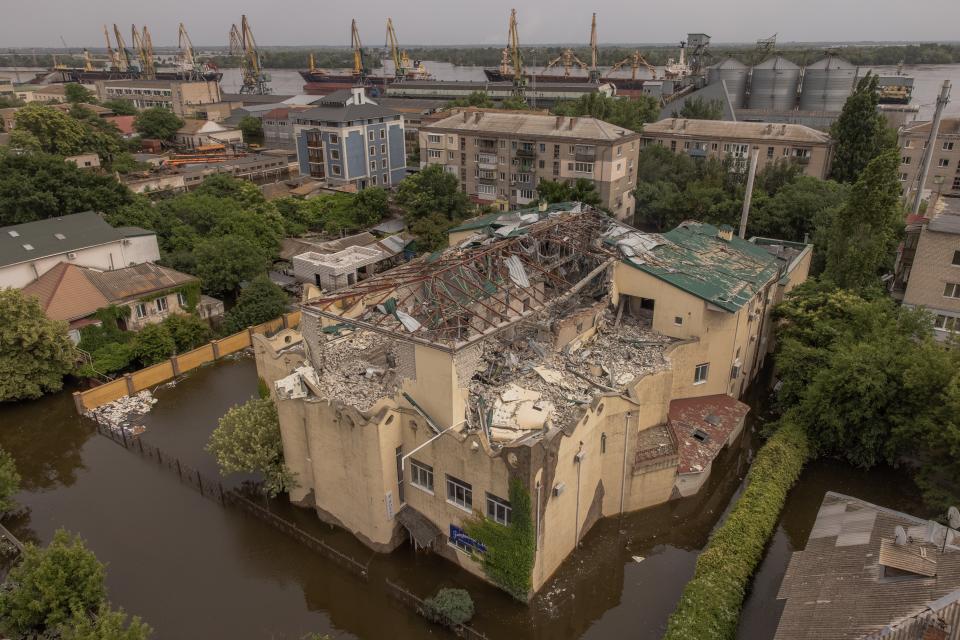 A damaged by shelling building is seen in a flooded area in Kherson, Ukraine (Getty Images)