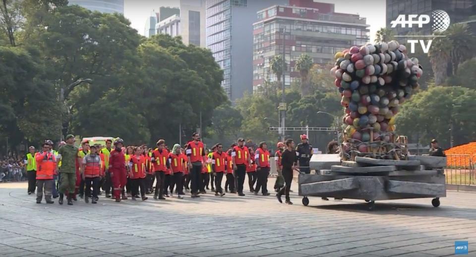 A&nbsp;float honoring rescue workers is seen at the start of Saturday's Day of the Dead parade in Mexico City, Mexico. (Photo: AFP)