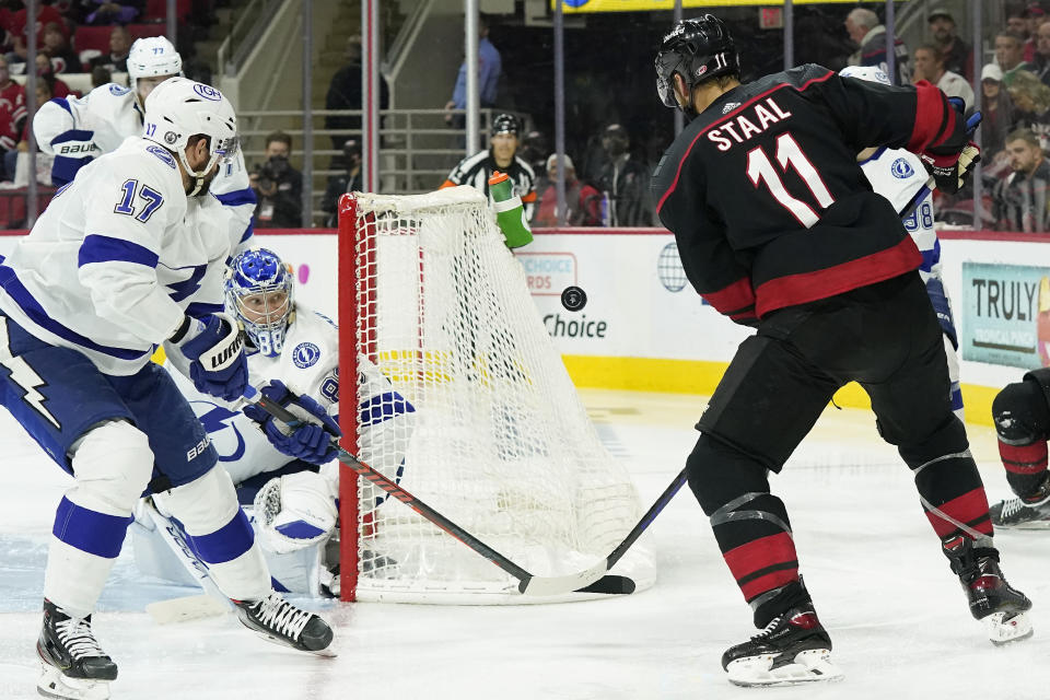 Tampa Bay Lightning goaltender Andrei Vasilevskiy (88) and left wing Alex Killorn (17) defend the goal against Carolina Hurricanes center Jordan Staal (11) during the second period in Game 5 of an NHL hockey Stanley Cup second-round playoff series in Raleigh, N.C., Tuesday, June 8, 2021. (AP Photo/Gerry Broome)