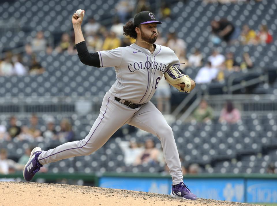 Rockies relief pitcher Justin Lawrence (61) pitches against the Pittsburgh Pirates during a 2022 game.