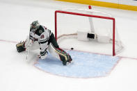 Minnesota Wild goaltender Marc-Andre Fleury pauses after giving up a goal to St. Louis Blues' Jordan Kyrou during a shootout of an NHL hockey game Saturday, March 16, 2024, in St. Louis. (AP Photo/Jeff Roberson)