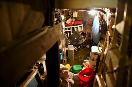 Floodwater engulfs objects in the cellar of house, after heavy rain in south London, Britain June 23, 2016. REUTERS/Staff