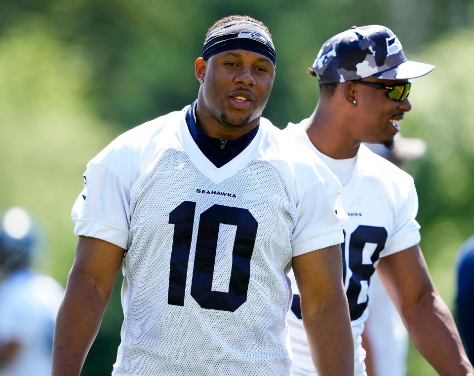 FILE - Seattle Seahawks linebacker Uchenna Nwosu walks on the field during minicamp June 6 at the team's facilities in Renton.  The Seahawks have locked up Nwosu for the next three seasons, agreeing to an extension worth up to $59 million on the cusp of training camp.