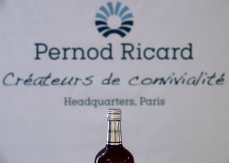 A logo is seen on a bottle of the Ricard aniseed-flavoured beverage displayed during French drinks maker Pernod Ricard news conference to announce the company annual results in Paris