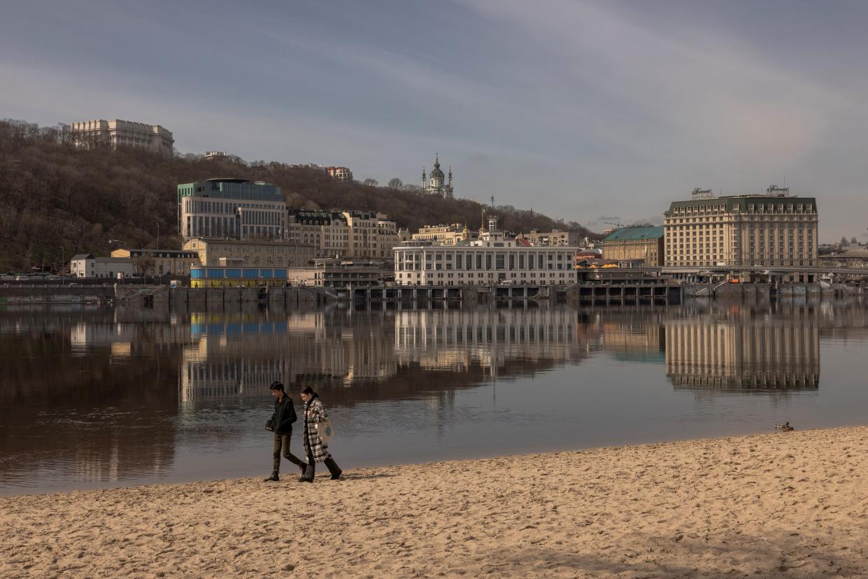 People walk along the Dnipro River on Trukhaniv Island on 7 April 2023 in Kyiv, Ukraine (Getty Images)