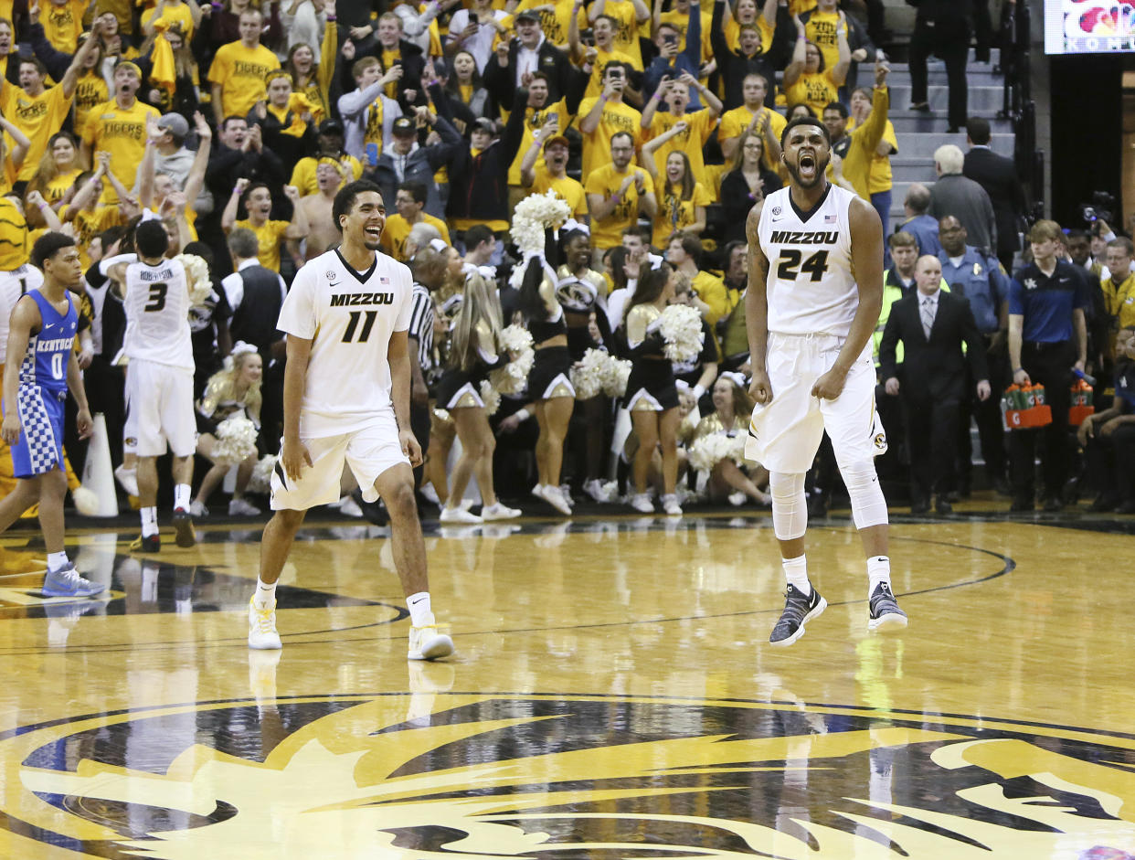 Missouri forwards Kevin Puryear (24) and Jontay Porter (11) celebrate after their team defeated Kentucky 69-60 in an NCAA college basketball game Saturday, Feb. 3, 2018, in Columbia, Mo. (Chris Lee/St. Louis Post-Dispatch via AP)