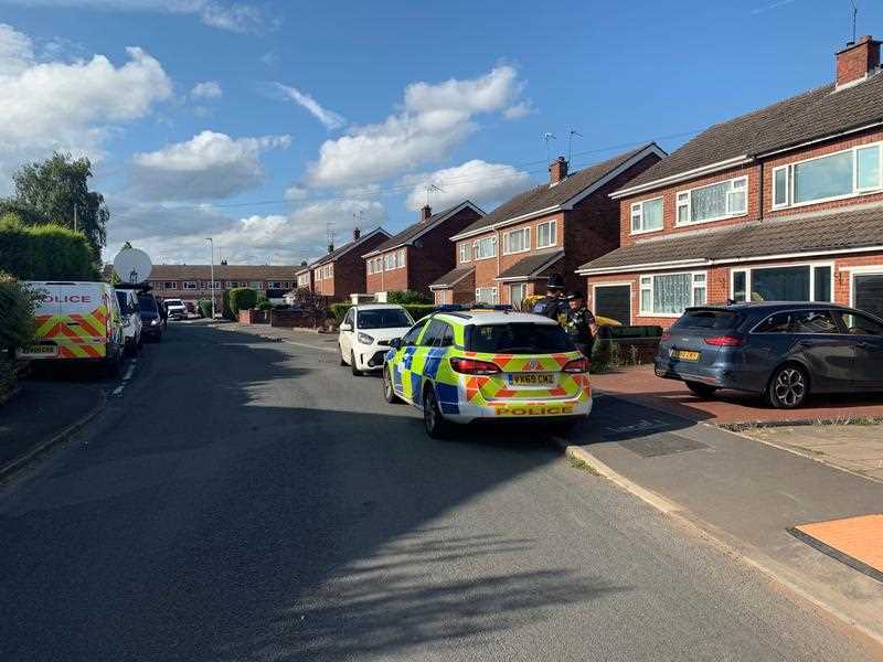 Police at the scene in Cairndhu Drive in Kidderminster, as an investigation has been launched after a serving police officer and child were found dead.