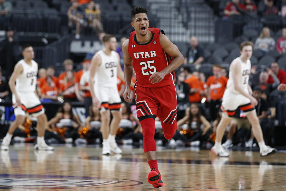 Utah's Alfonso Plummer (25) reacts after making a 3-point shot against Oregon State during the first half of an NCAA college basketball game in the first round of the Pac-12 men's tournament Wednesday, March 11, 2020, in Las Vegas. (AP Photo/John Locher)