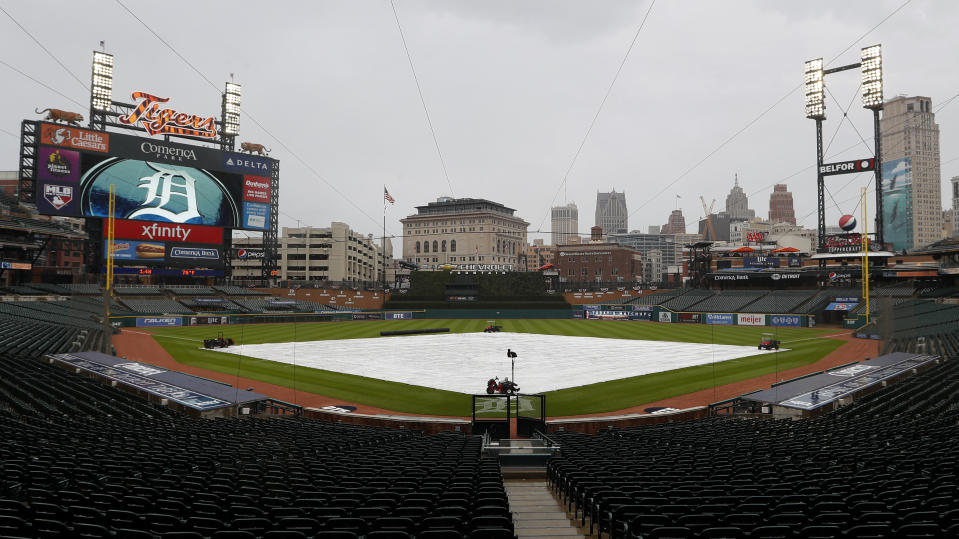 Rain falls on Comerica Park during a weather delay for a baseball game between the Cincinnati Reds and Detroit Tigers in Detroit, Saturday, Aug. 1, 2020. (AP Photo/Paul Sancya)