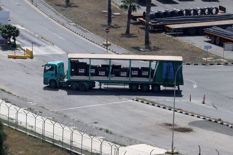 A truck carrying cargo with UAE flags is seen at the port of Larnaca
