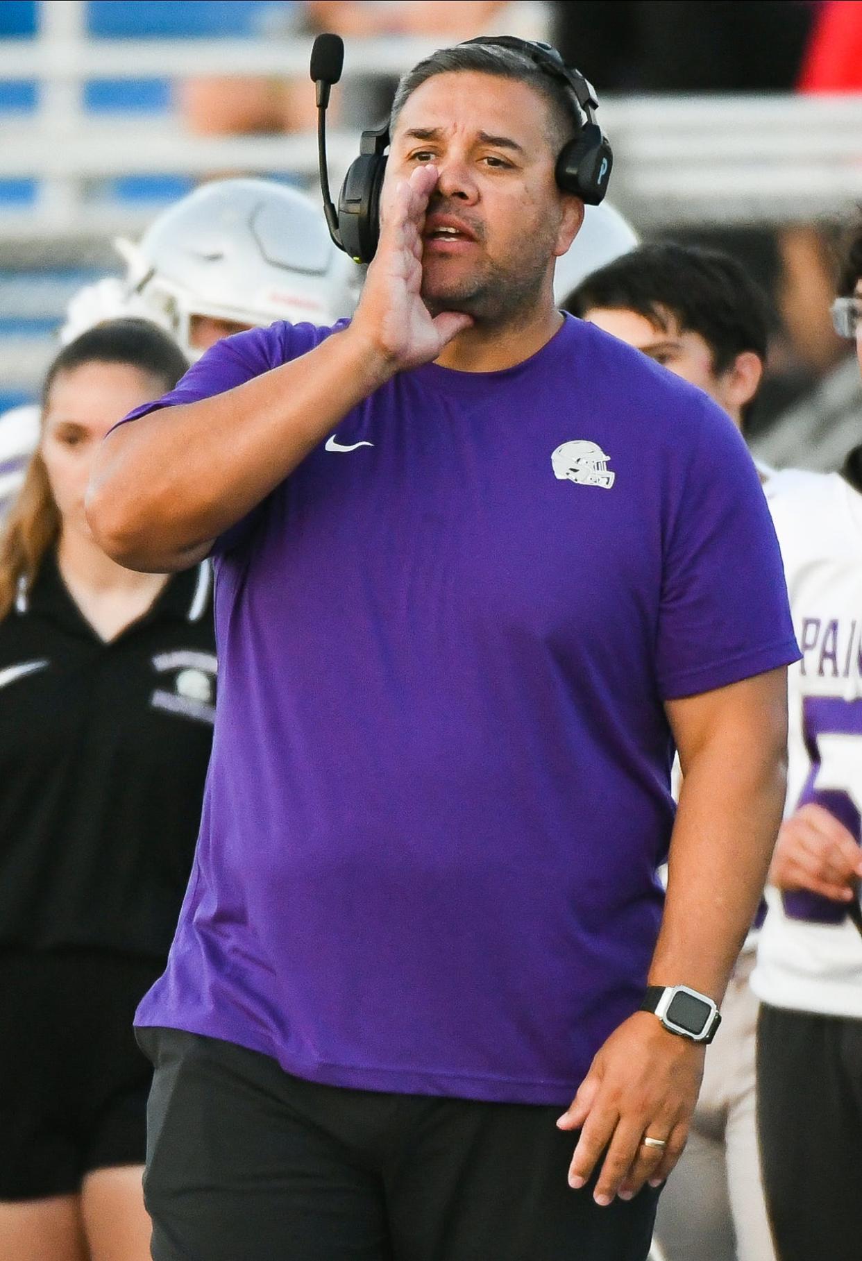 Bloomington South head coach Gabe Johnson gives instructions during the football game against Columbus North at North on Friday, Sept. 29, 2023.