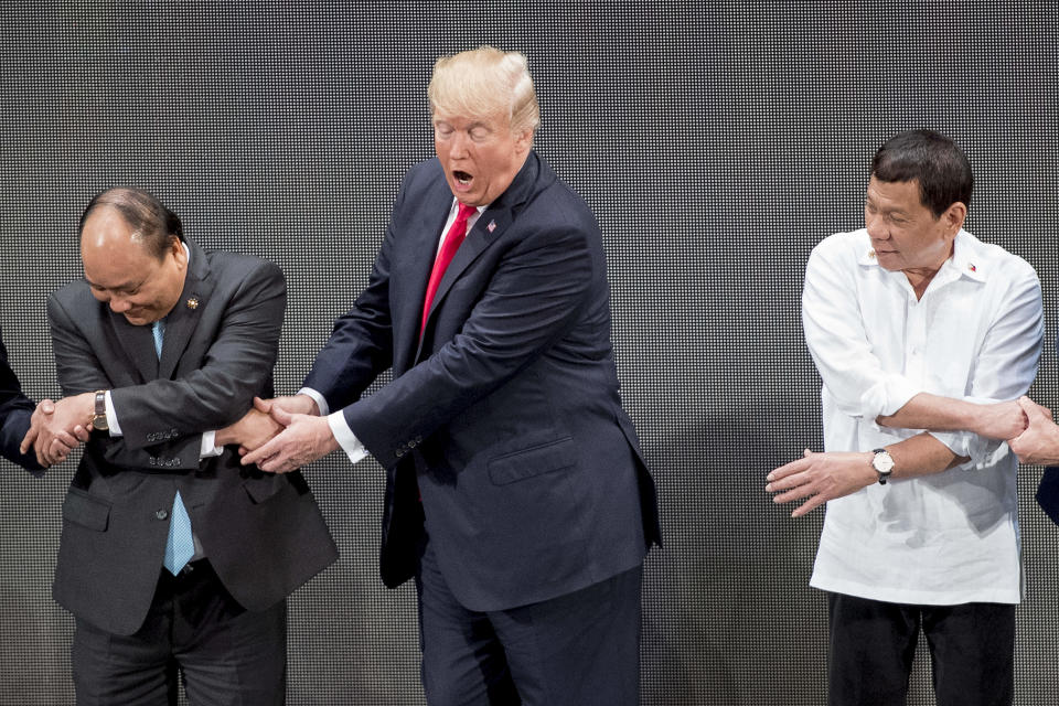 5. Trump begins switching his hands.