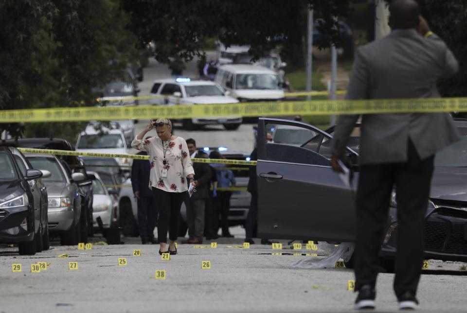 More that two people were killed in a shooting Wednesday, July 29, 2020, in the Walnut Park West neighborhood of north St. Louis shortly before 2 p.m. Police received multiple reports of a shooting and officers found several victims suffering from gunshot wounds in the 5500 block of Floy Avenue, near Emma Avenue. It wasn't clear what prompted the gunfire but authorities said it stemmed from a dispute between two groups. (David Carson/St. Louis Post-Dispatch via AP)