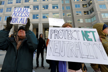 FILE PHOTO: Net neutrality advocates rally in front of the Federal Communications Commission (FCC) ahead of Thursday's expected FCC vote repealing so-called net neutrality rules in Washington, U.S., December 13, 2017. REUTERS/Yuri Gripas/File Photo