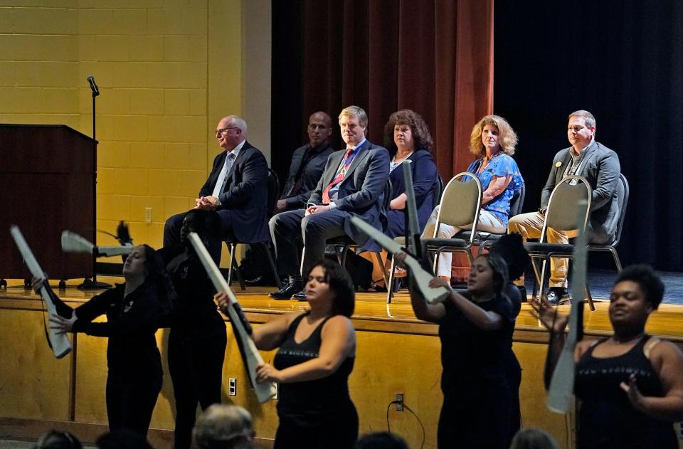 Parade co-founder Bob Bone, left, and former Lord Mayor of Westminster Duncan Sandys watch the University High School band perform during a ceremony at the school to invite the band to play at the 2024 London New Year's Day parade, Wednesday, Nov. 16, 2022.