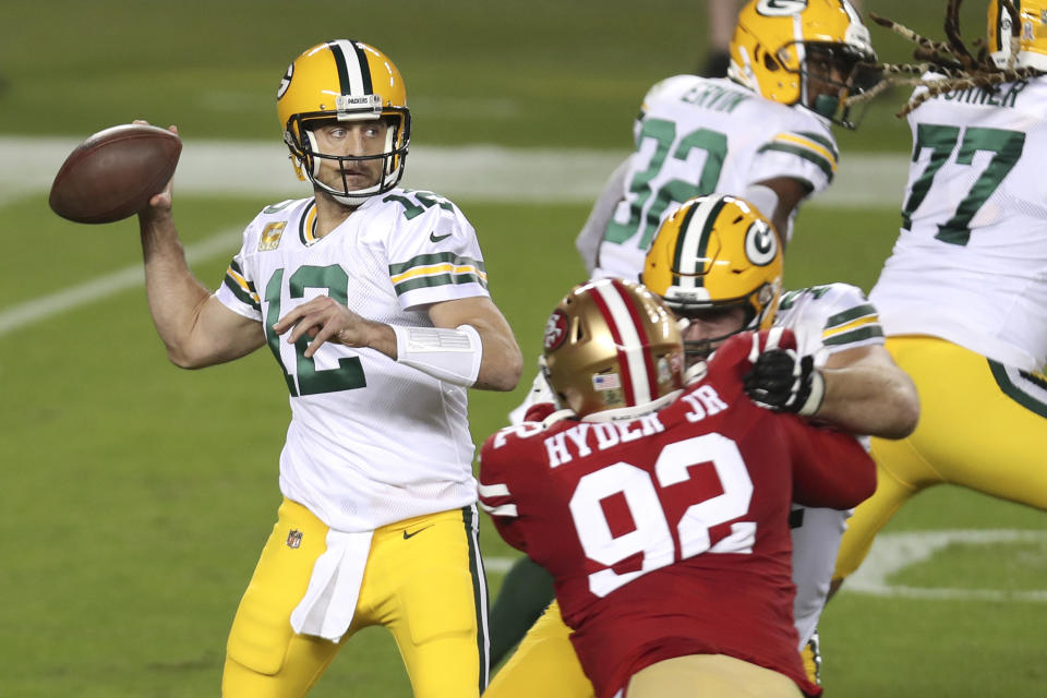 Green Bay Packers quarterback Aaron Rodgers (12) passes against the San Francisco 49ers during the first half of an NFL football game in Santa Clara, Calif., Thursday, Nov. 5, 2020. (AP Photo/Jed Jacobsohn)