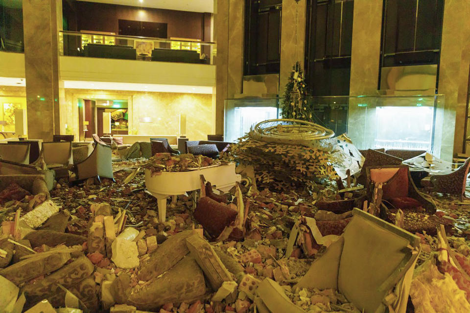 In this photo provided by Kharkiv Regional Administration, the ruined lobby of Kharkiv Palace Hotel is seen after Russia's missile attack in Kharkiv, Ukraine, Sunday, Dec. 31, 2023. (Kharkiv Regional Administration via AP)