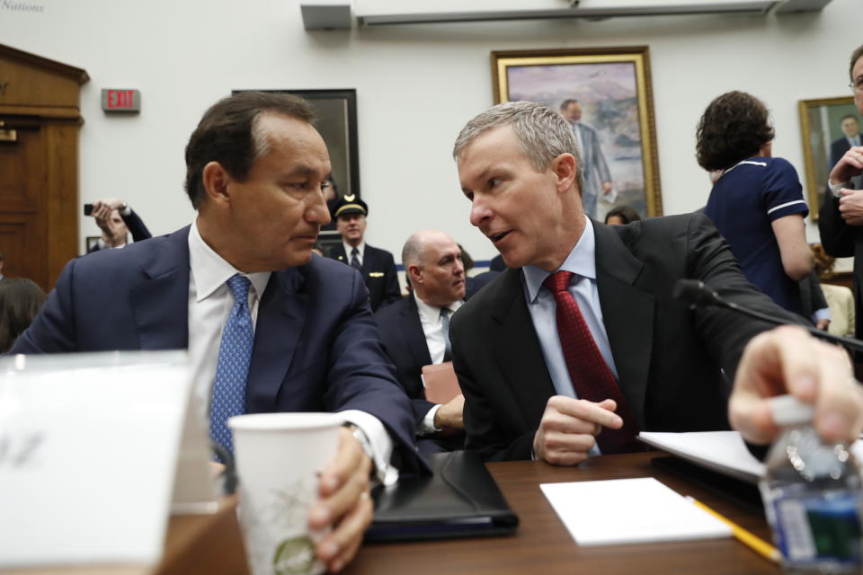 FILE - In this May 2, 2017, file photo United Airlines CEO Oscar Munoz, left, talks with United Airlines President Scott Kirby on Capitol Hill in Washington prior to testifying before the House Transportation Committee oversight hearing. United Airlines CEO Munoz is stepping down from his post and will become executive chairman. The airline said Thursday, Dec. 5, 2019, that Kirby will be its new CEO. (AP Photo/Pablo Martinez Monsivais, File)