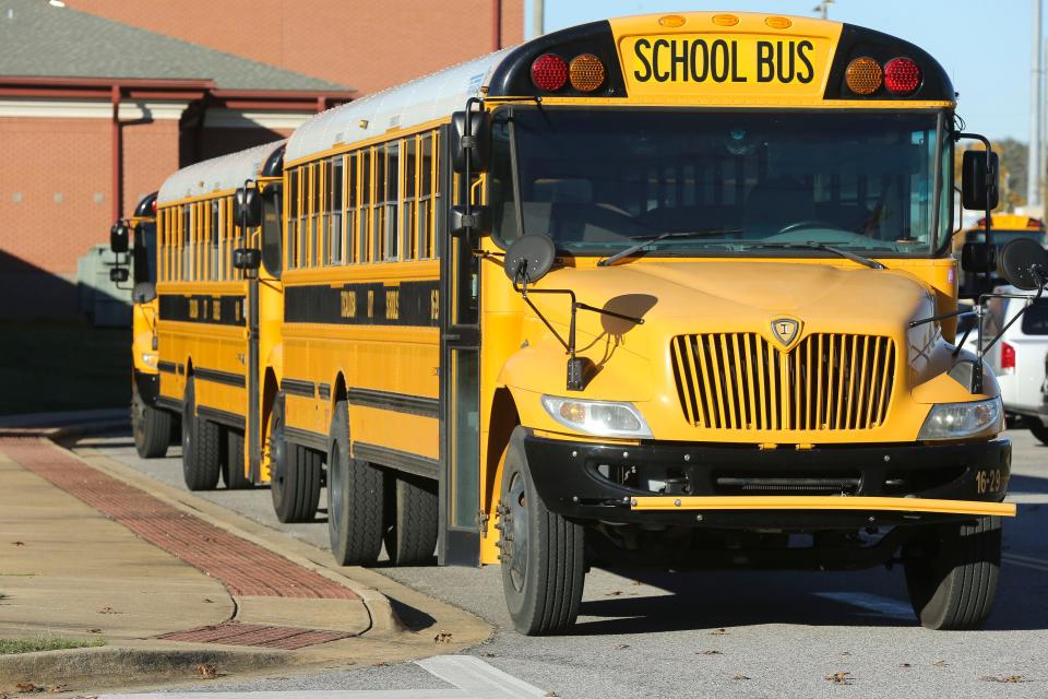 School buses are seen waiting to load at Westlawn Middle School in Tuscaloosa Tuesday, Dec. 1, 2020. [Staff Photo/Gary Cosby Jr.]
