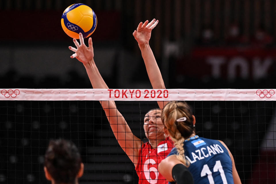 <p>Russia's Irina Koroleva attempts to block a shot in the women's preliminary round pool B volleyball match between Russia and Argentina during the Tokyo 2020 Olympic Games at Ariake Arena in Tokyo on July 27, 2021. (Photo by ANGELA WEISS / AFP)</p> 