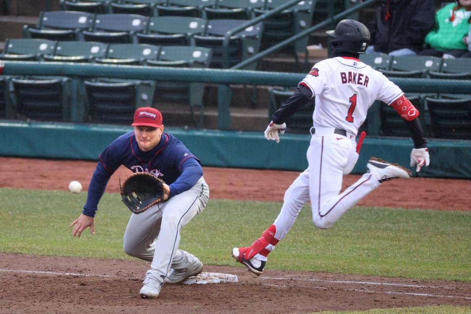 Rochester’s Darren Baker beats the throw to Lehigh Valley first baseman John Hicks. 